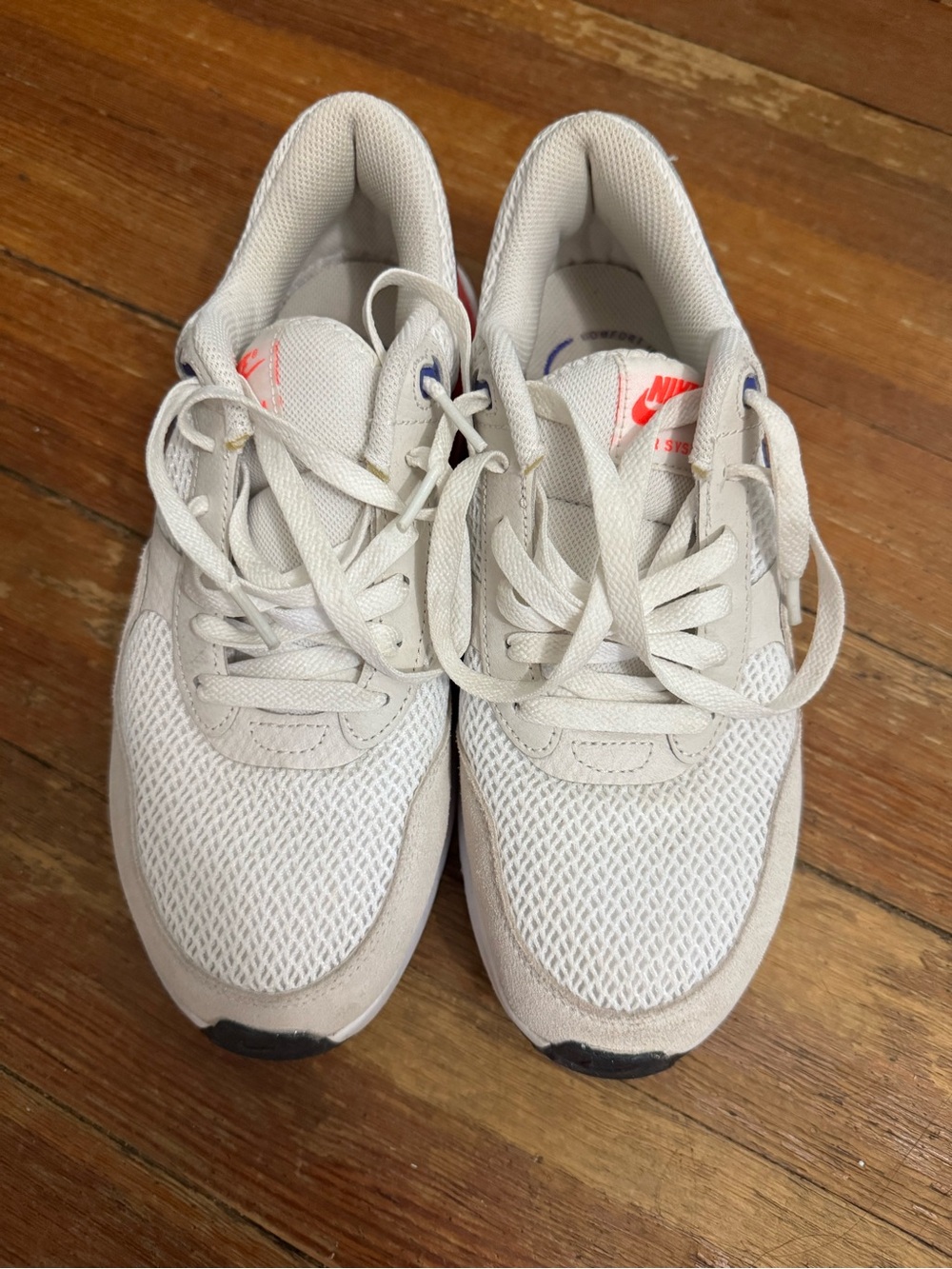 Nike White Mesh Sneakers with Beige Overlays and Coral Swoosh
